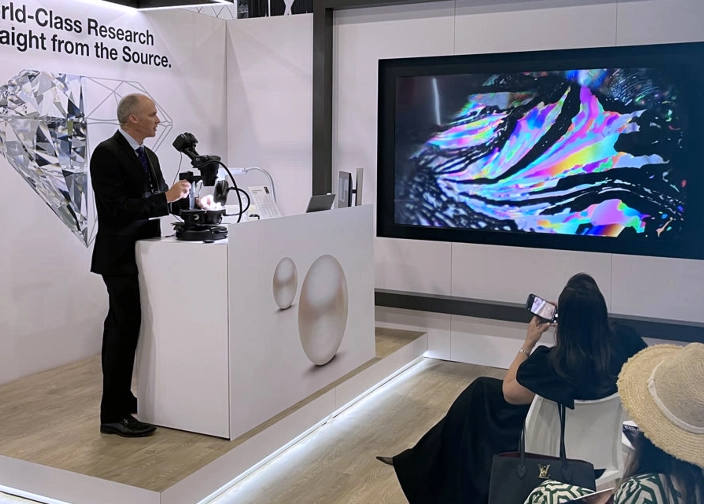 GIA researcher presenting at the Main Booth